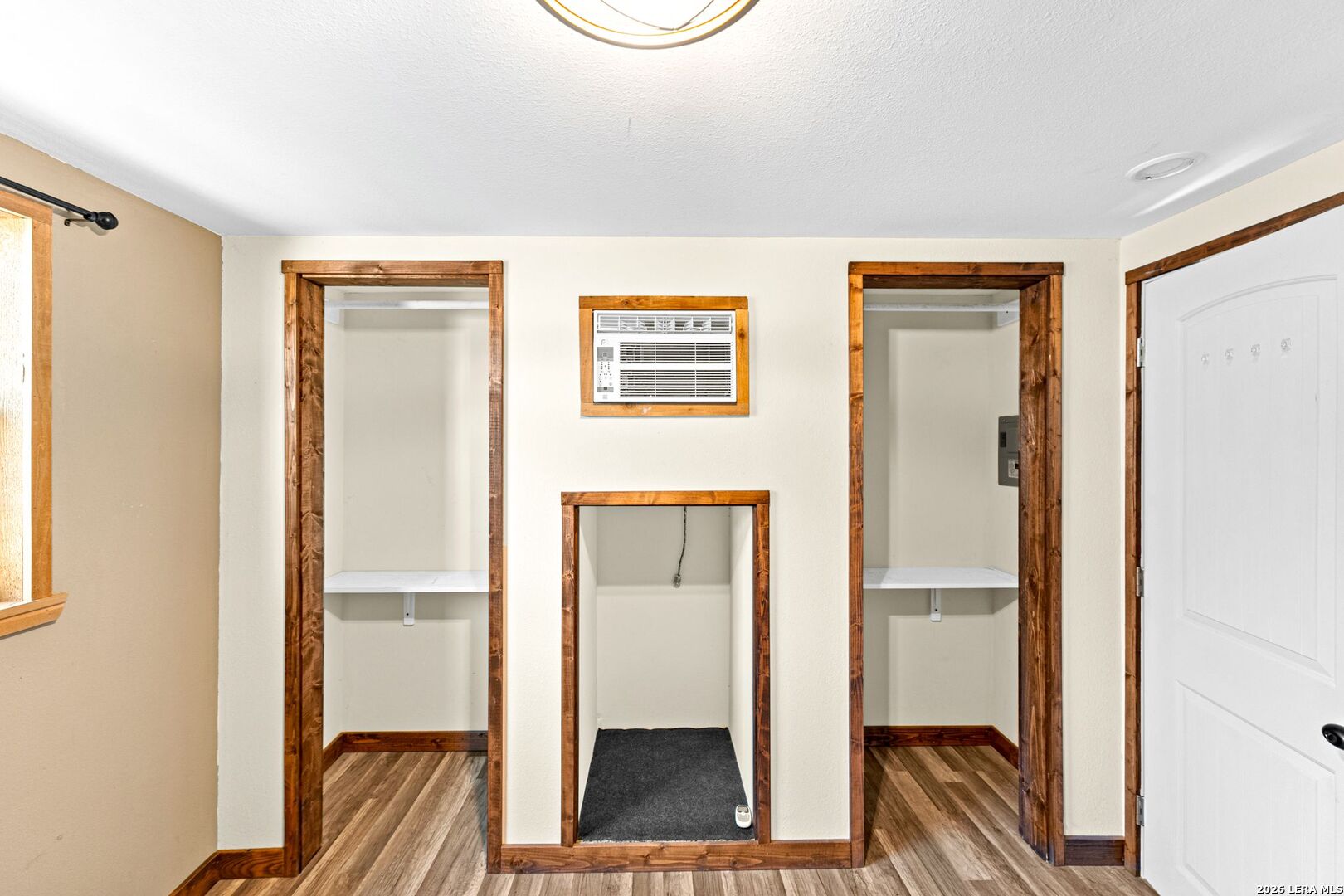 297 Chaparral Drive Bandera, TX 78003 - Photo 5 of 19 a view of a hallway with wooden floor and entryway