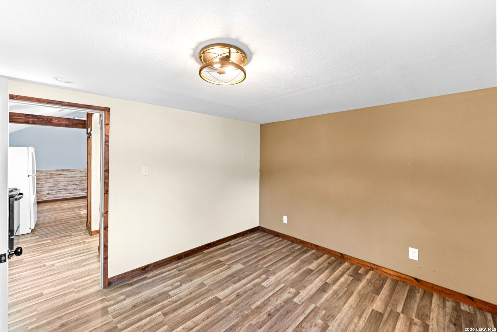 297 Chaparral Drive Bandera, TX 78003 - Photo 6 of 19 a view of empty room with wooden floor