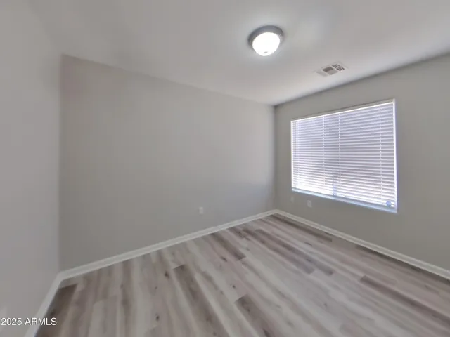 a view of a kitchen with a sink and a refrigerator