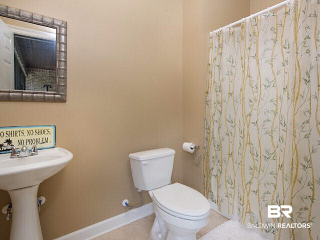 7814 Balin Drive Daphne, AL 36527 - Photo 21 of 26 This conveniently placed bathroom with independant access to back porch and pool area is great when entertaining inside or out!