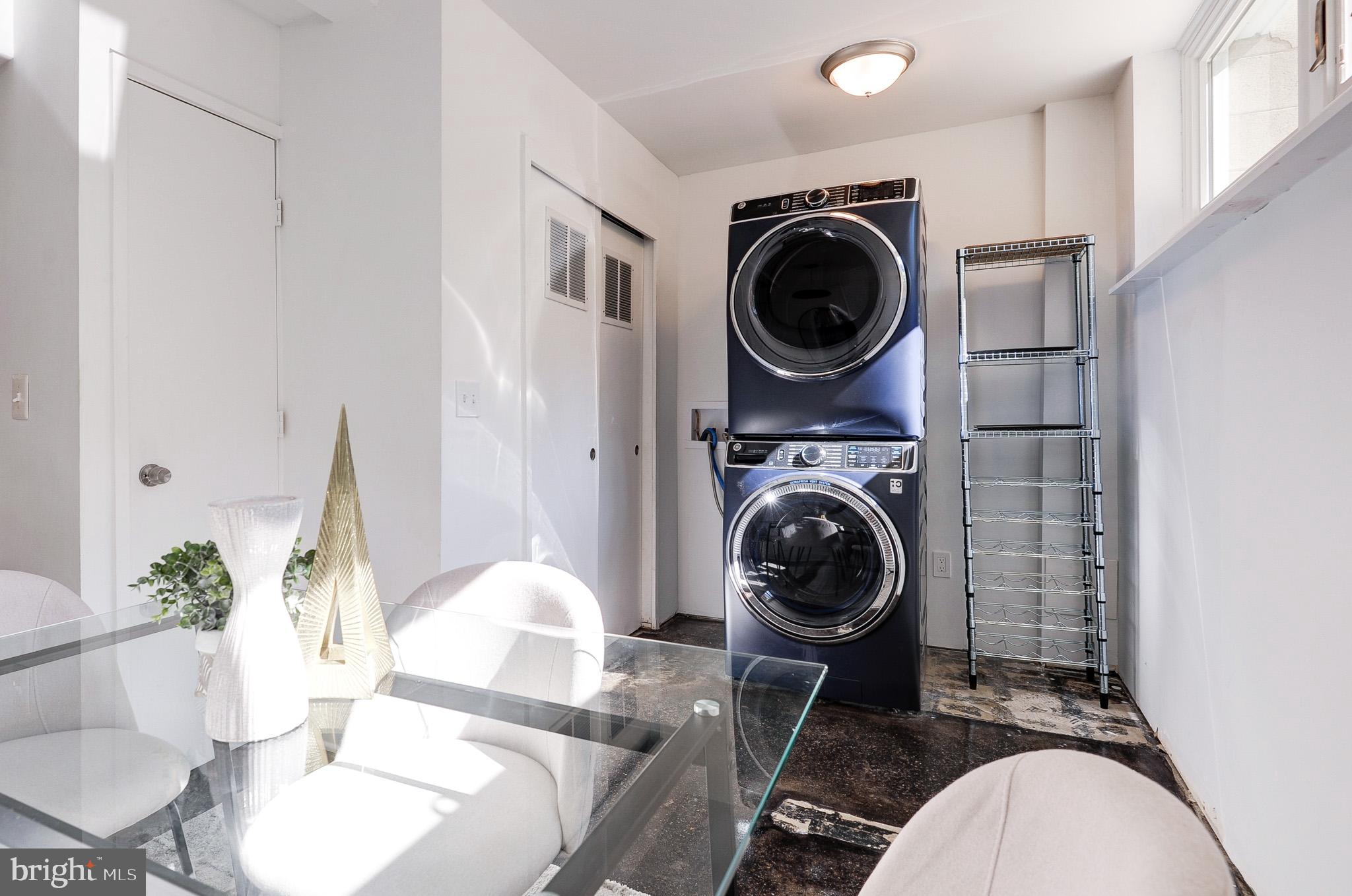 11533 Maple Ridge Road Reston, VA 20190 - Photo 28 of 48 Modern laundry space with sleek appliances.