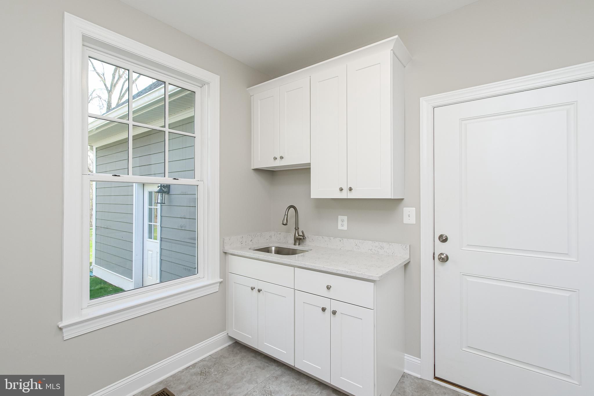 14442 Liberty Road Mount Airy, MD 21771 - Photo 46 of 51 Main level laundry/mud room w/utility sink