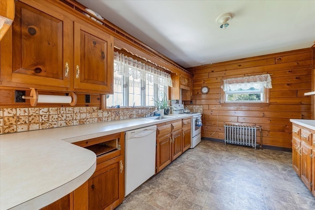 70 Hedge Road Plymouth, MA 02360 - Photo 21 of 41 a kitchen with stainless steel appliances granite countertop a sink a stove and a refrigerator