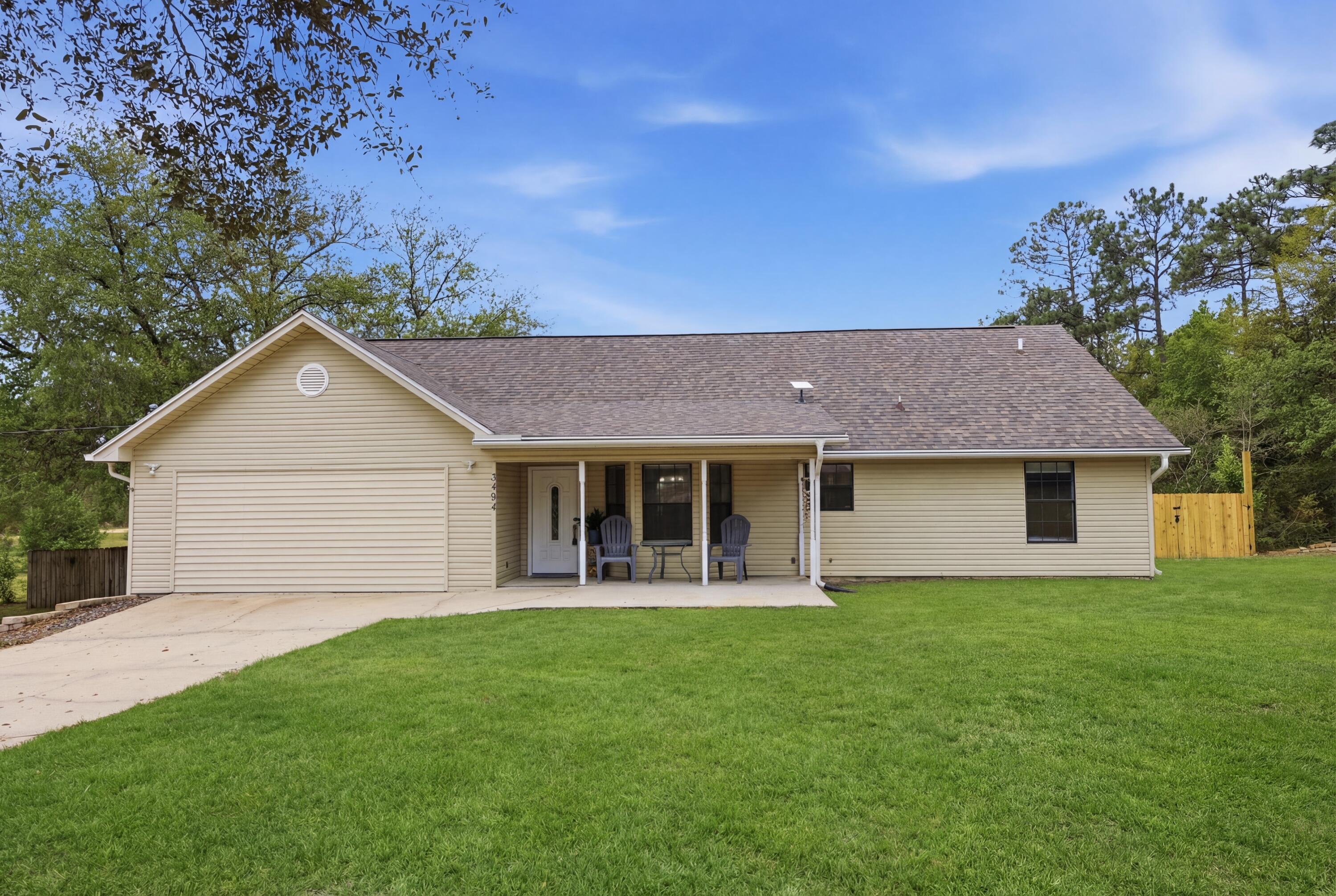 3494 Highway 90 Crestview, FL 32539 - Photo 1 of 71 a front view of house with yard and green space