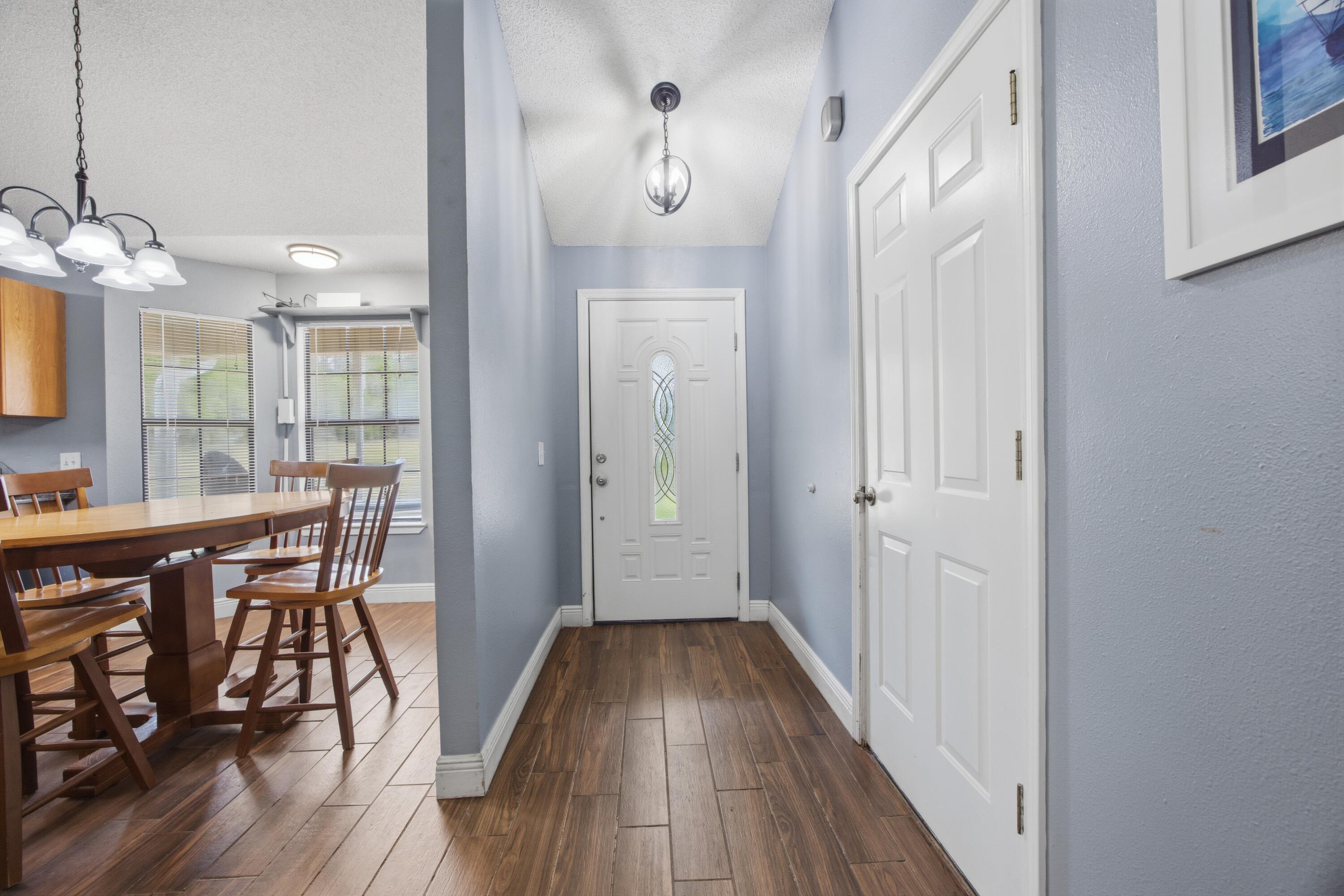 3494 Highway 90 Crestview, FL 32539 - Photo 16 of 71 a view of a hallway with wooden floor and staircase