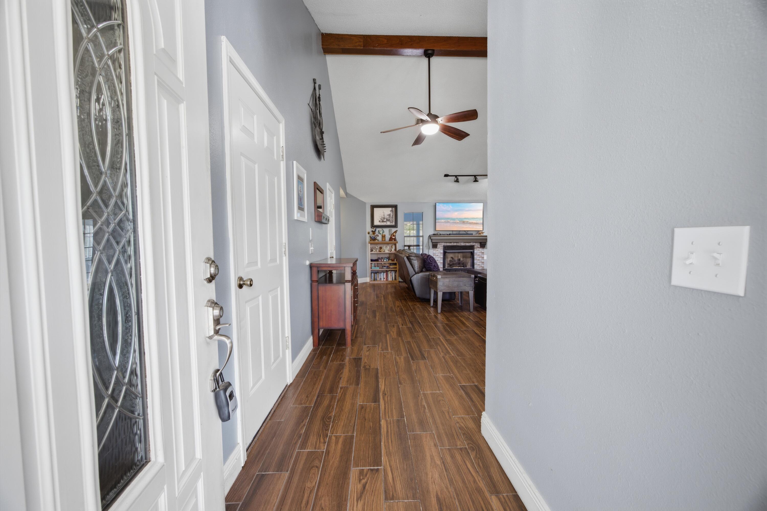 3494 Highway 90 Crestview, FL 32539 - Photo 17 of 71 a view of a hallway with wooden floor and a livingroom