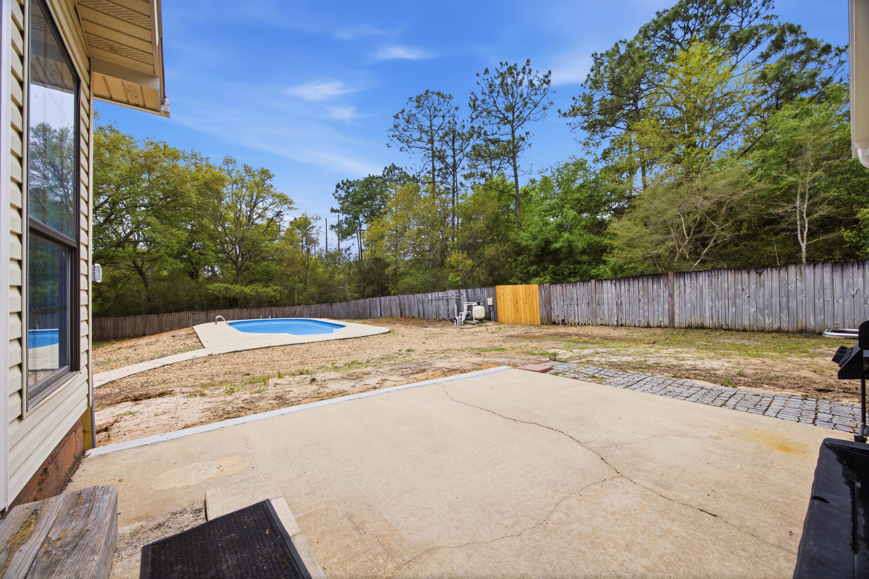 3494 Highway 90 Crestview, FL 32539 - Photo 2 of 71 a view of a backyard of the house