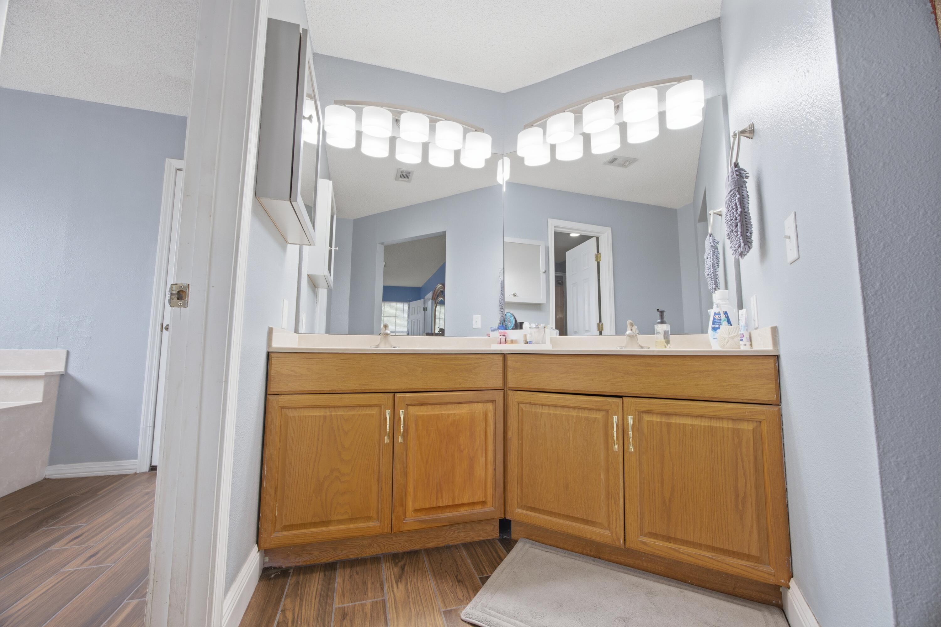 3494 Highway 90 Crestview, FL 32539 - Photo 24 of 71 a bathroom with a sink a vanity and a mirror