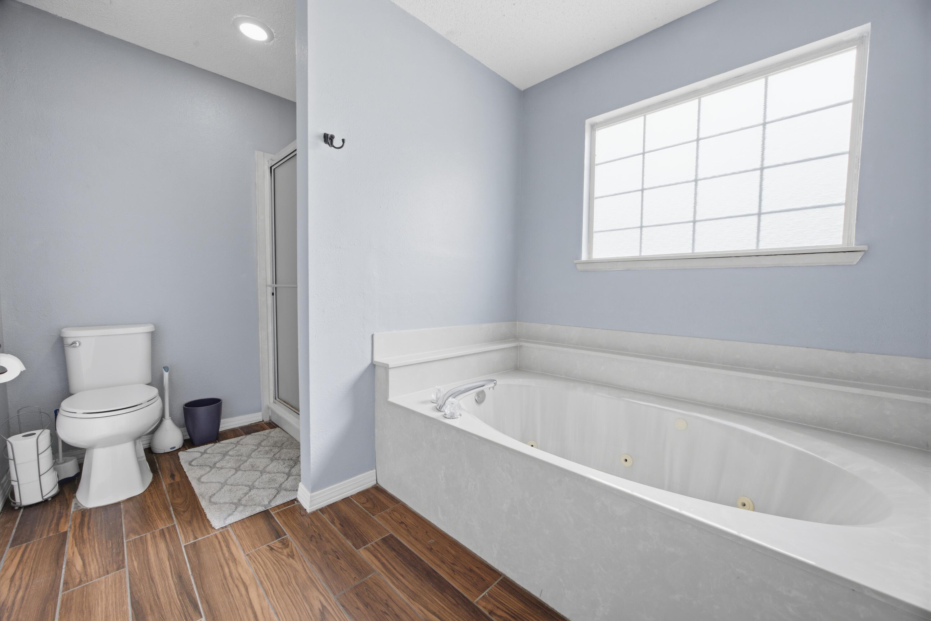 3494 Highway 90 Crestview, FL 32539 - Photo 26 of 71 a bathroom with a tub toilet and a window