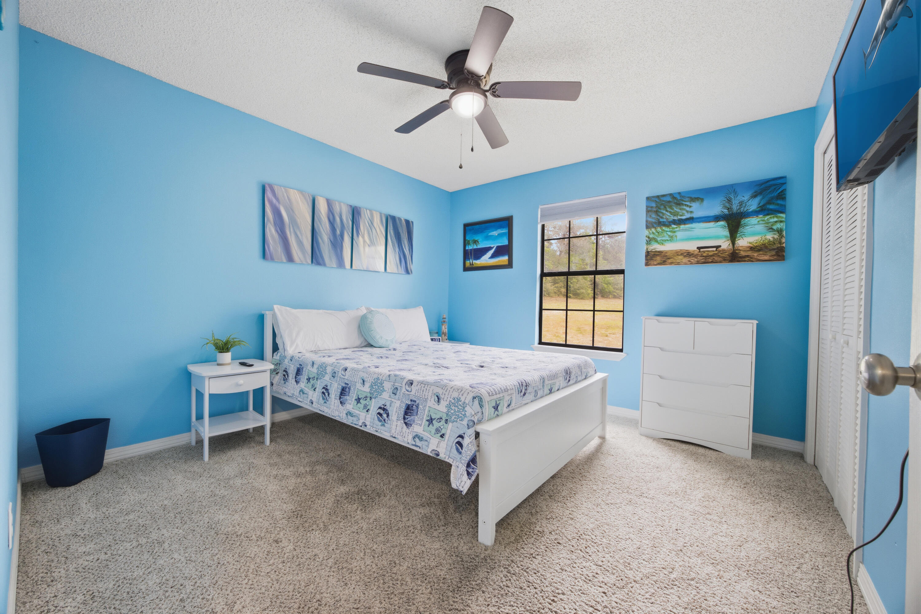 3494 Highway 90 Crestview, FL 32539 - Photo 34 of 71 a bedroom with a bed and a chandelier