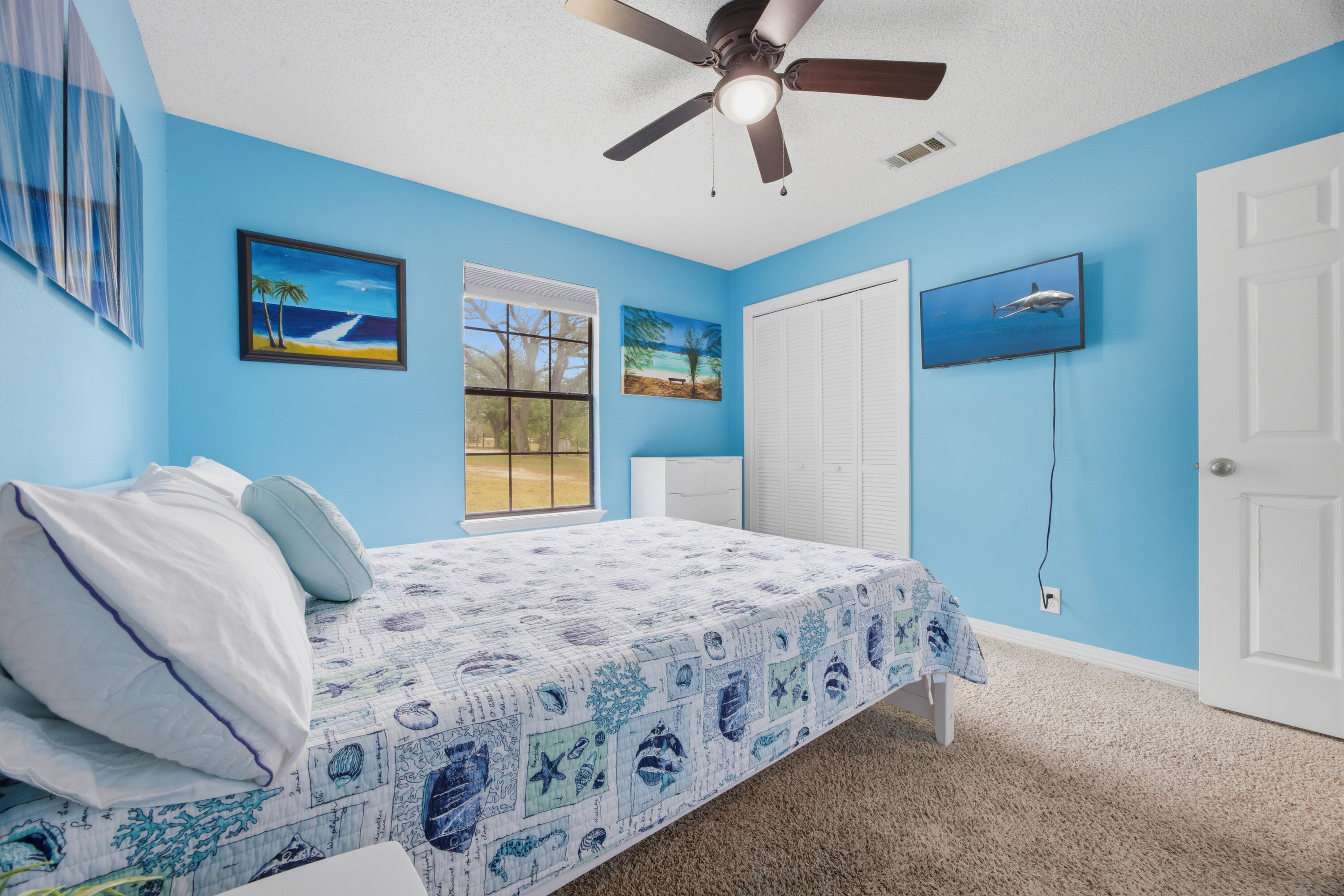 3494 Highway 90 Crestview, FL 32539 - Photo 36 of 71 a bedroom with a large bed and a chandelier