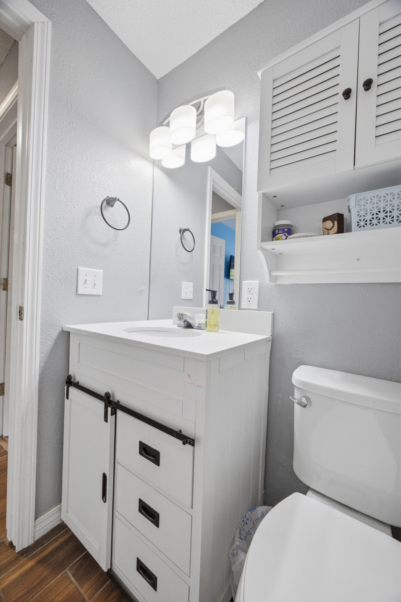 3494 Highway 90 Crestview, FL 32539 - Photo 39 of 71 a bathroom with a sink a toilet and a mirror