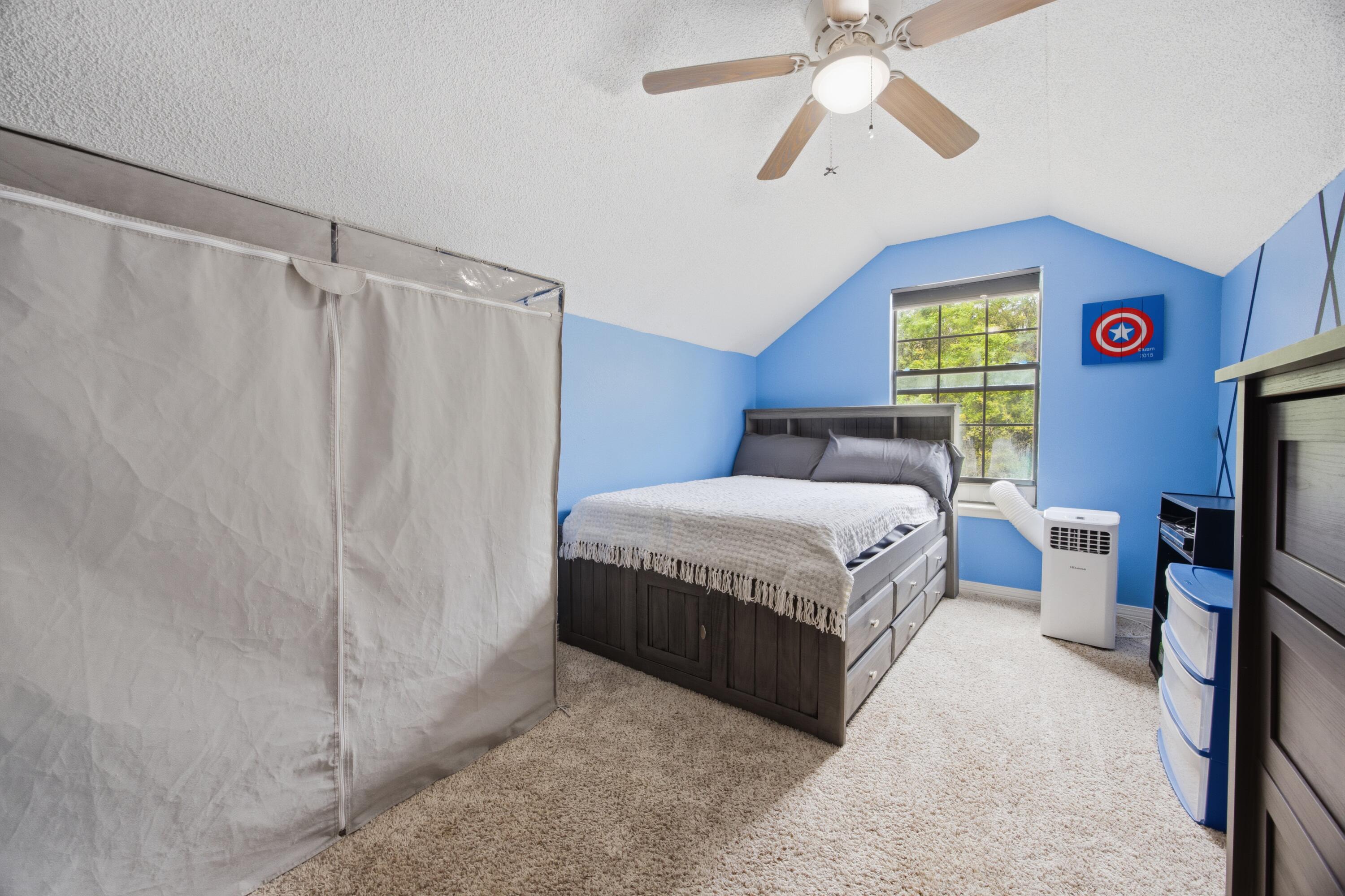 3494 Highway 90 Crestview, FL 32539 - Photo 43 of 71 a bedroom with a bed and a chandelier