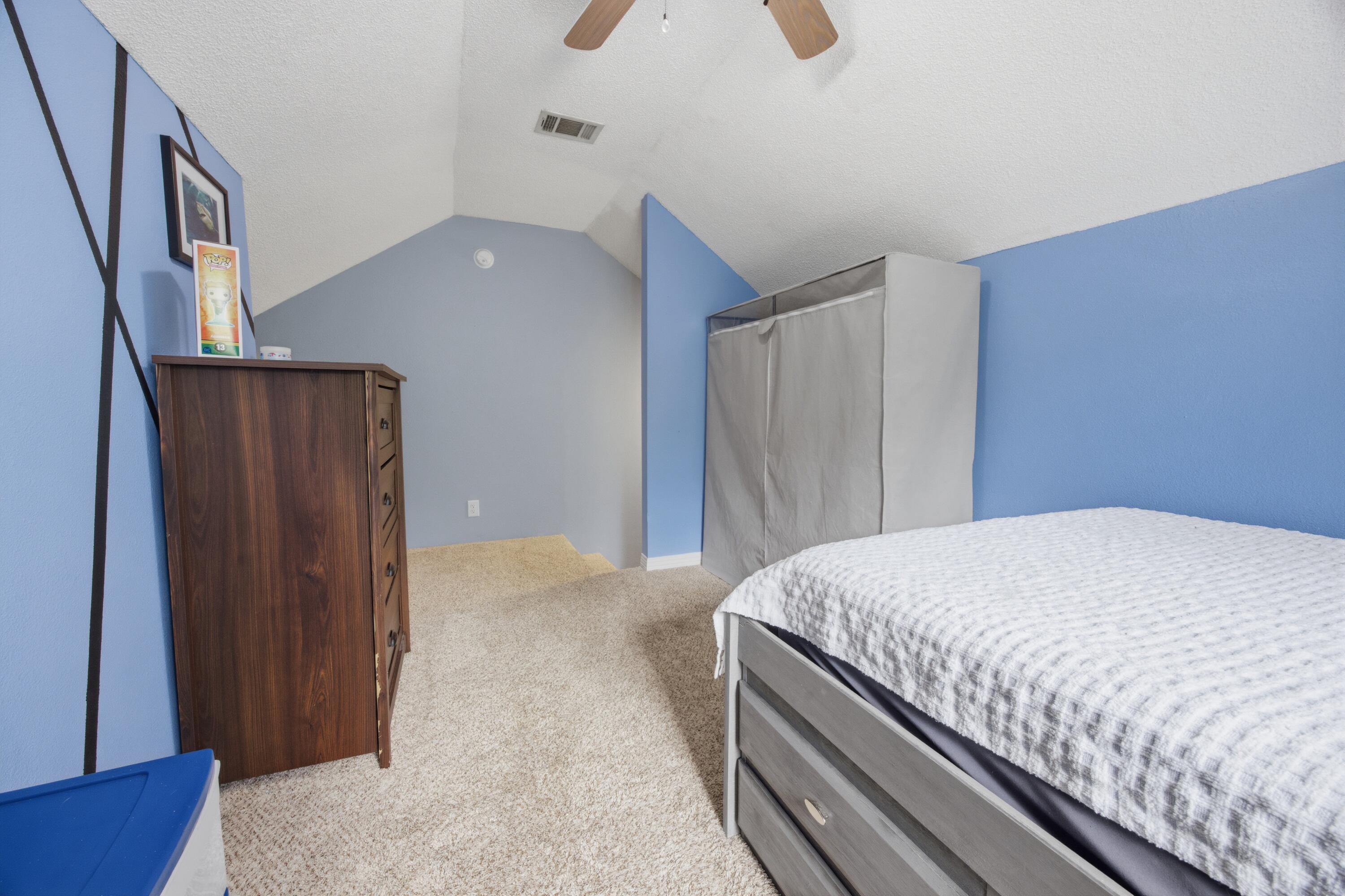 3494 Highway 90 Crestview, FL 32539 - Photo 45 of 71 a bedroom with a bed and a refrigerator