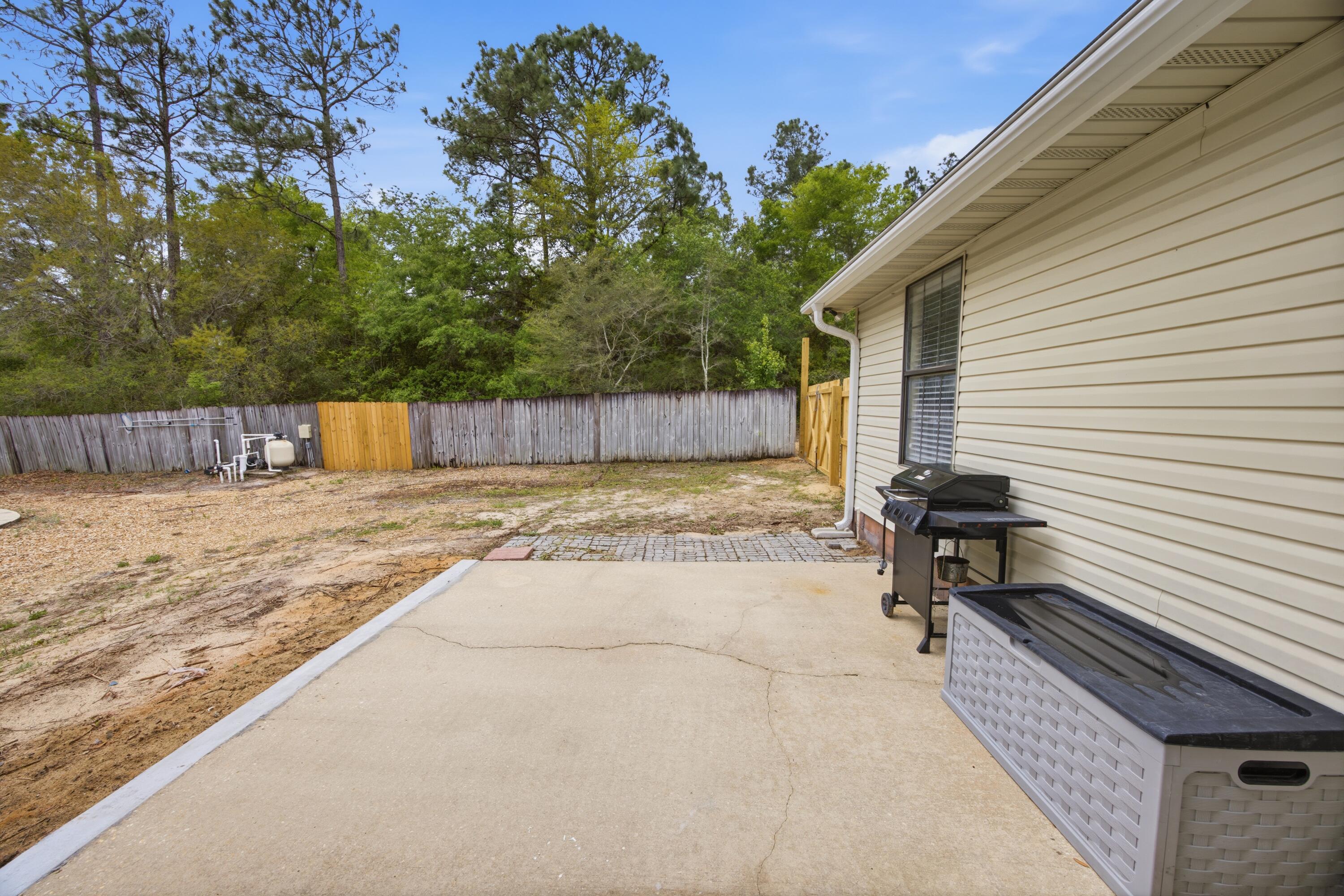 3494 Highway 90 Crestview, FL 32539 - Photo 56 of 71 a view of a backyard with a sitting area