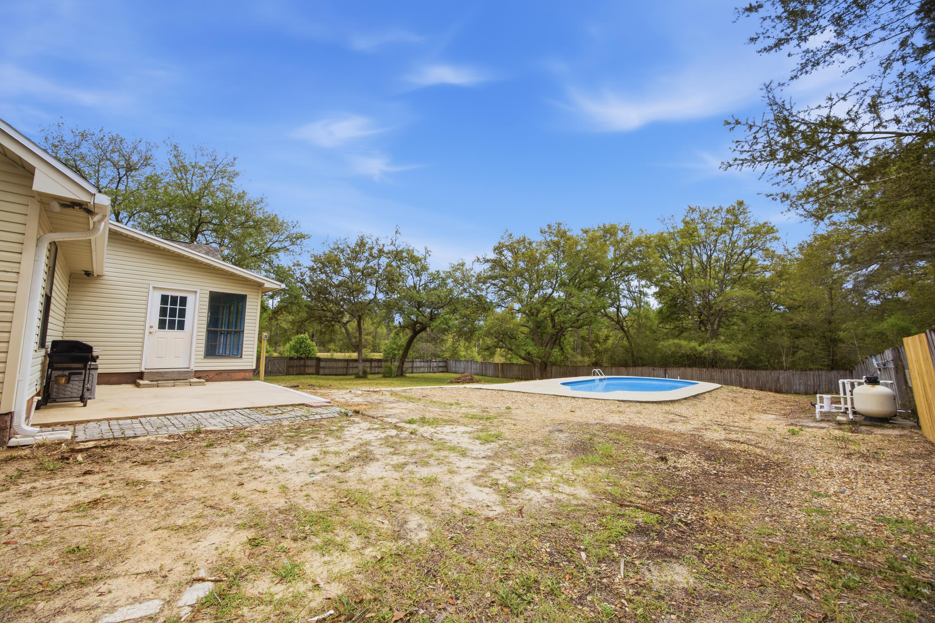 3494 Highway 90 Crestview, FL 32539 - Photo 57 of 71 a view of a house with backyard and trees