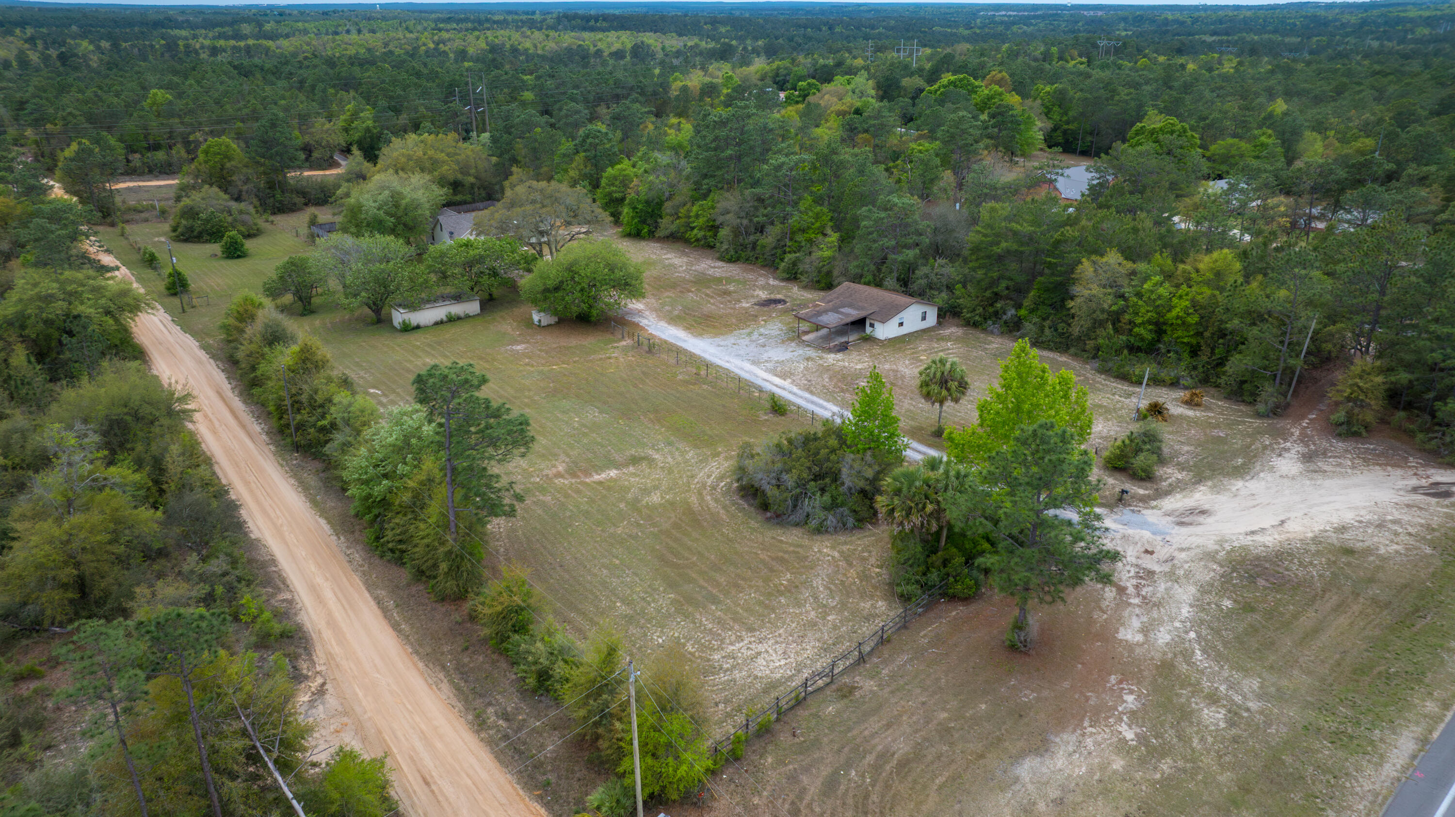 3494 Highway 90 Crestview, FL 32539 - Photo 65 of 71 an aerial view of a house with a yard