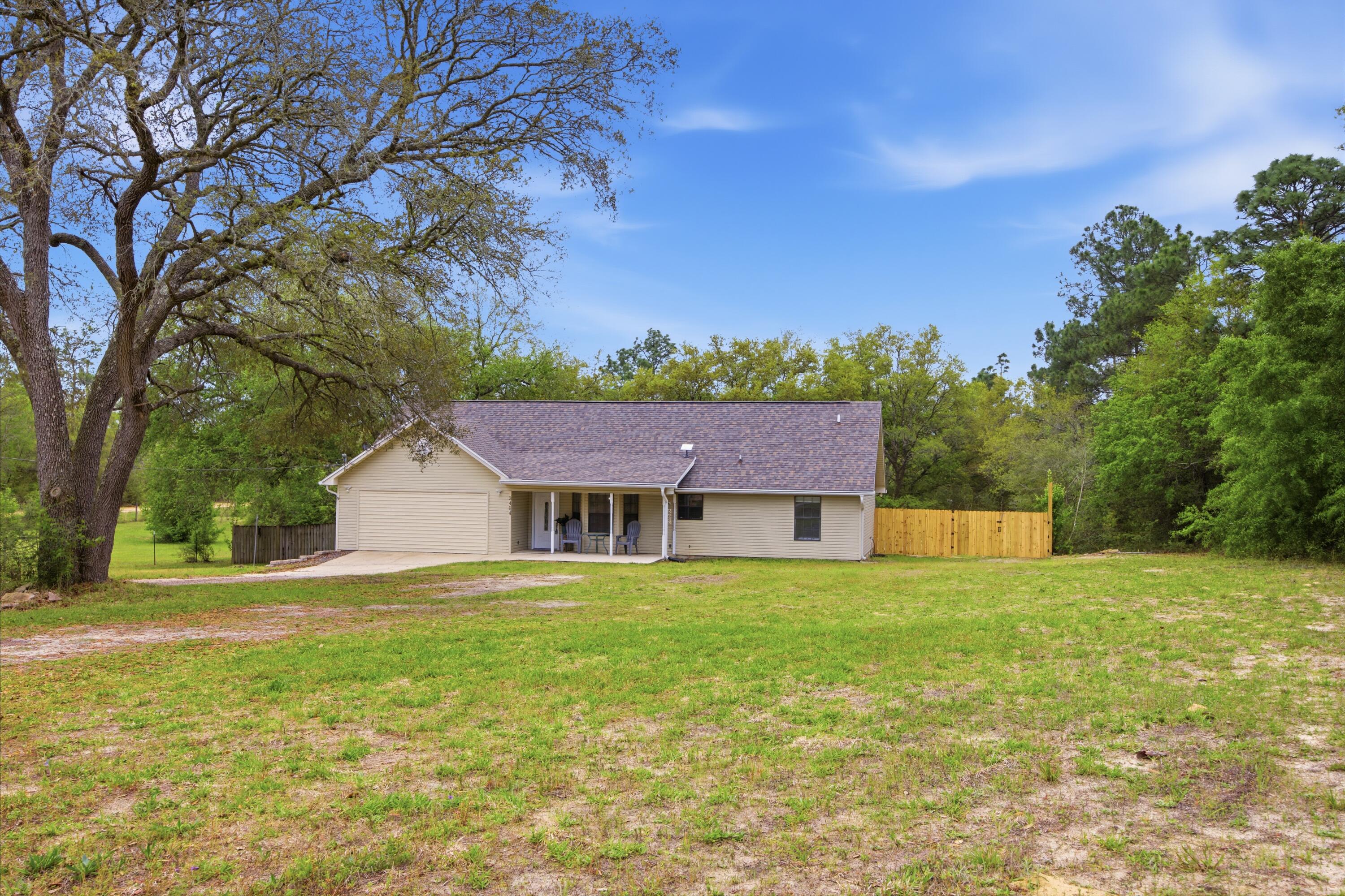 3494 Highway 90 Crestview, FL 32539 - Photo 70 of 71 a view of a house with a yard