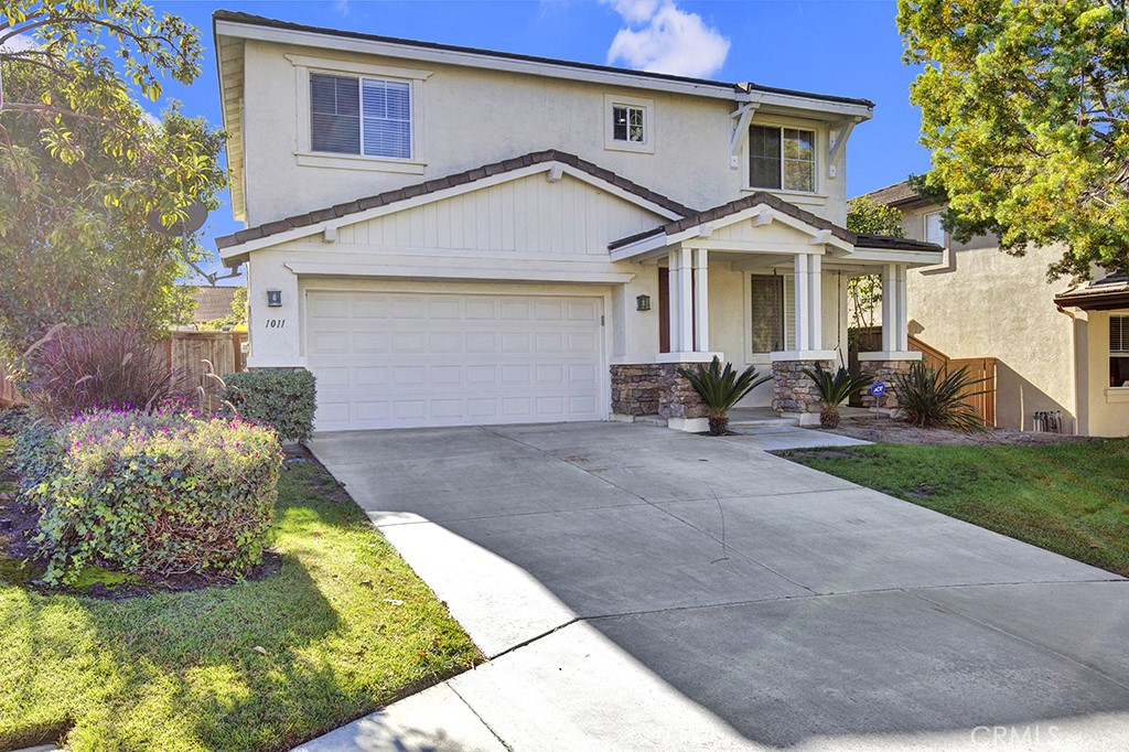 1011 Greenway Road Oceanside, CA 92057 - Photo 1 of 1 a front view of a house with garden