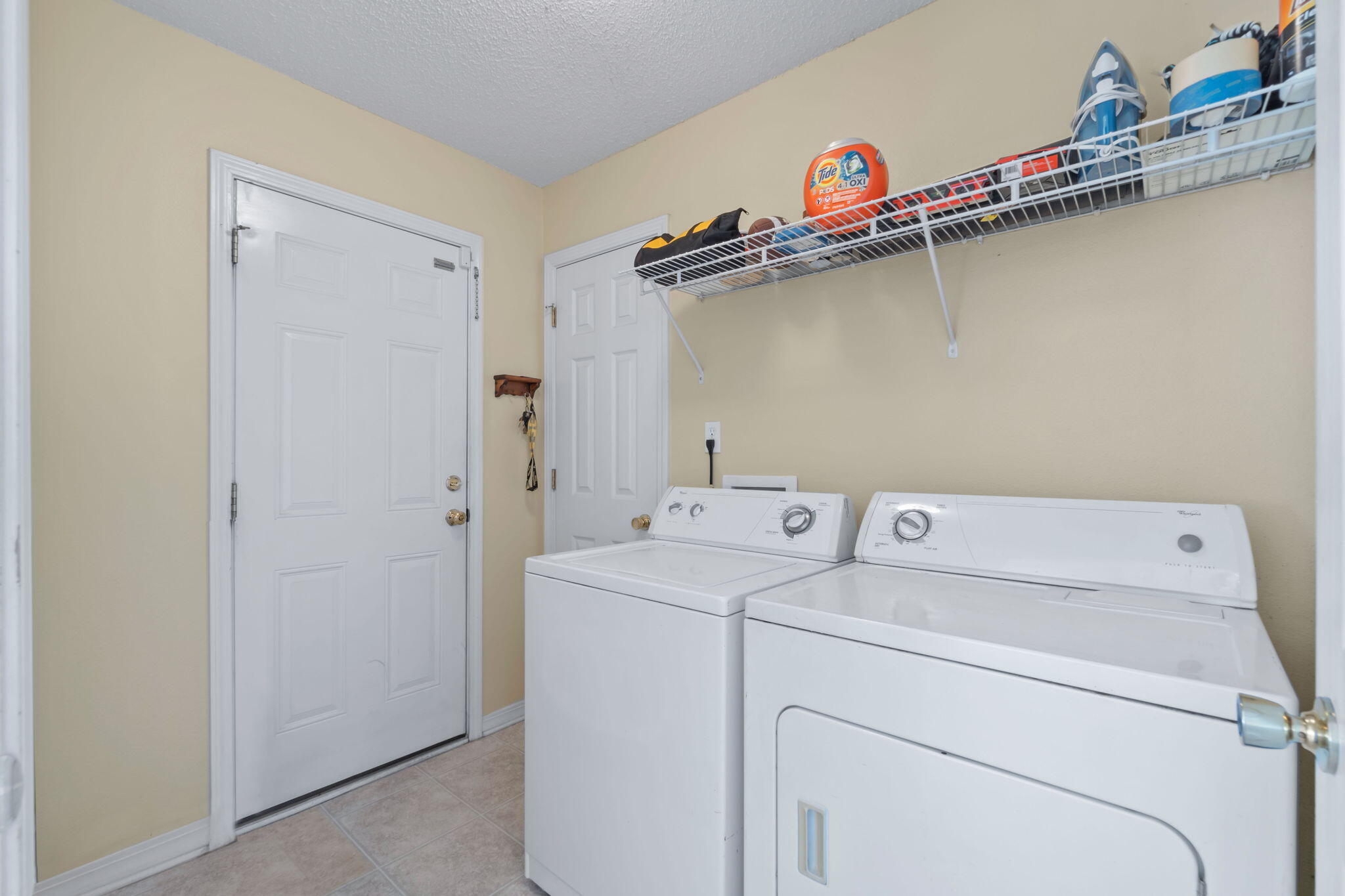 246 Limestone Circle Crestview, FL 32539 - Photo 12 of 27 a utility room with dryer and washer