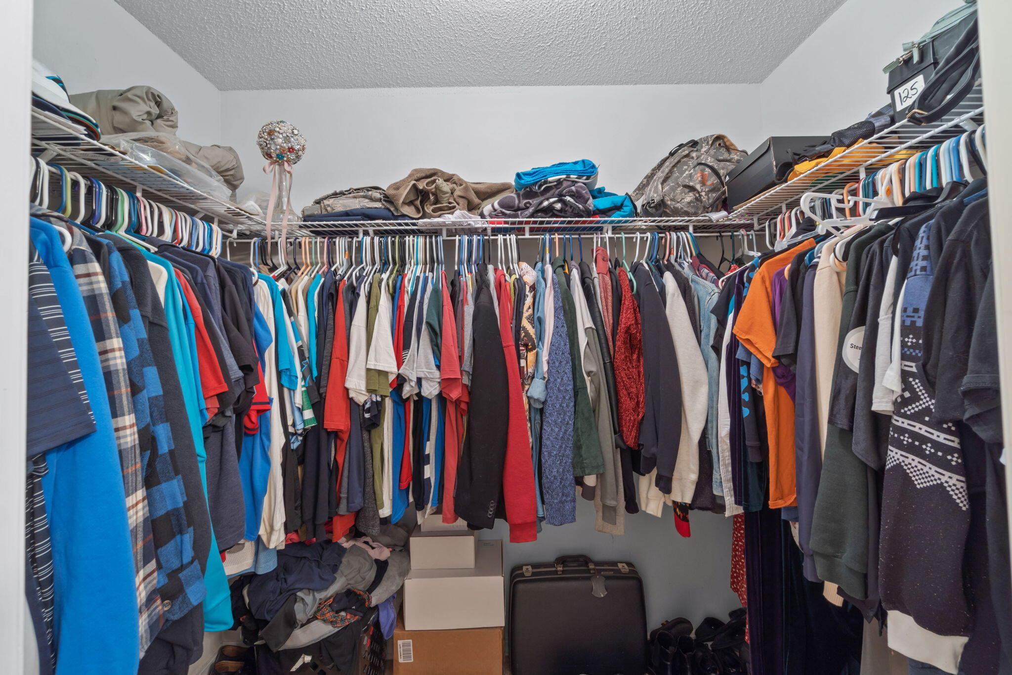 246 Limestone Circle Crestview, FL 32539 - Photo 21 of 27 a view of walk in closet with clothes
