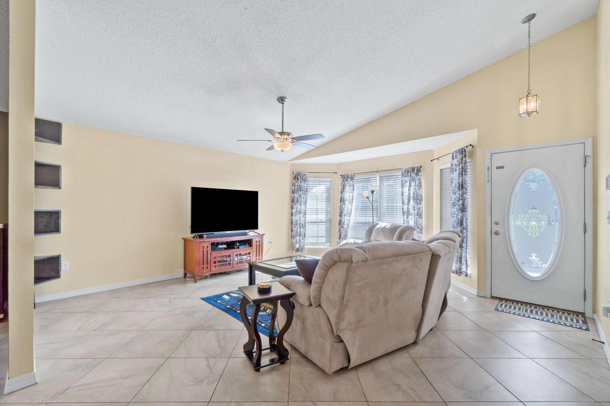 246 Limestone Circle Crestview, FL 32539 - Photo 4 of 27 a living room with furniture and a flat screen tv