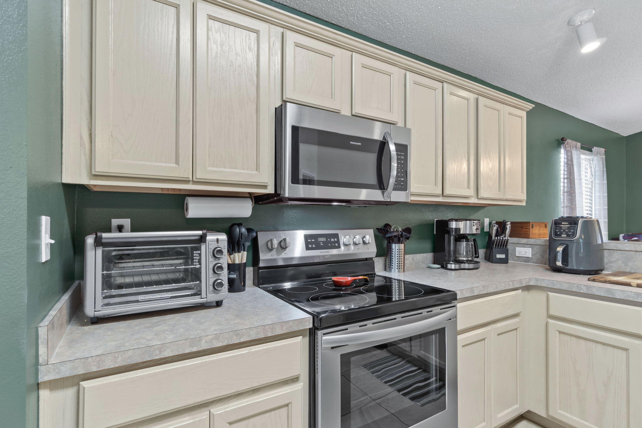 246 Limestone Circle Crestview, FL 32539 - Photo 10 of 27 a kitchen with granite countertop a stove a sink and dishwasher