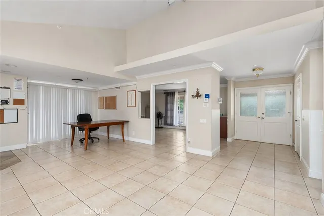 a view of a living room filled with furniture and a table