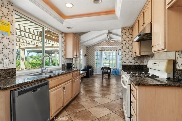 a kitchen with lots of counter top space and a window