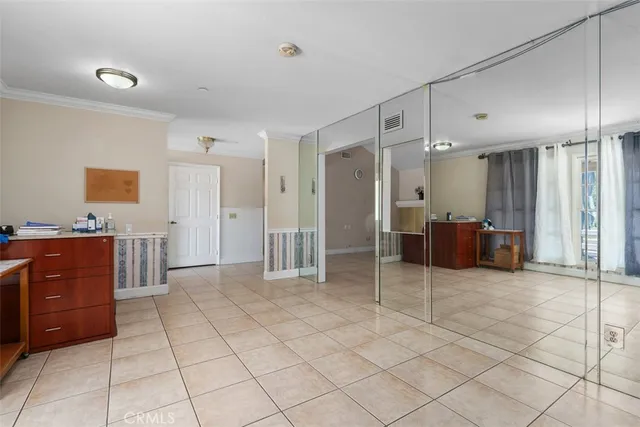 a room with a bed and a cabinets