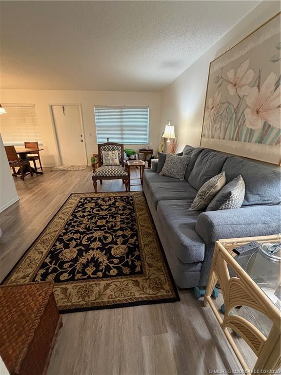 1225 Northwest 21st Street, Unit 7705 Stuart, FL 34994 - Photo 11 of 28 a living room with furniture and a couch