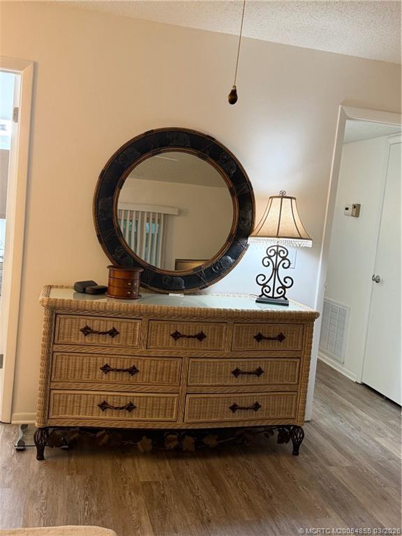 1225 Northwest 21st Street, Unit 7705 Stuart, FL 34994 - Photo 14 of 28 a view of dresser with mirror