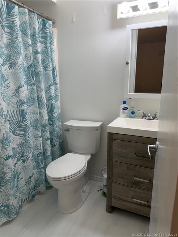 1225 Northwest 21st Street, Unit 7705 Stuart, FL 34994 - Photo 15 of 28 a bathroom with a sink and a toilet
