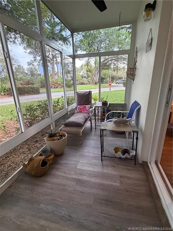 1225 Northwest 21st Street, Unit 7705 Stuart, FL 34994 - Photo 19 of 28 a room with furniture and a large window