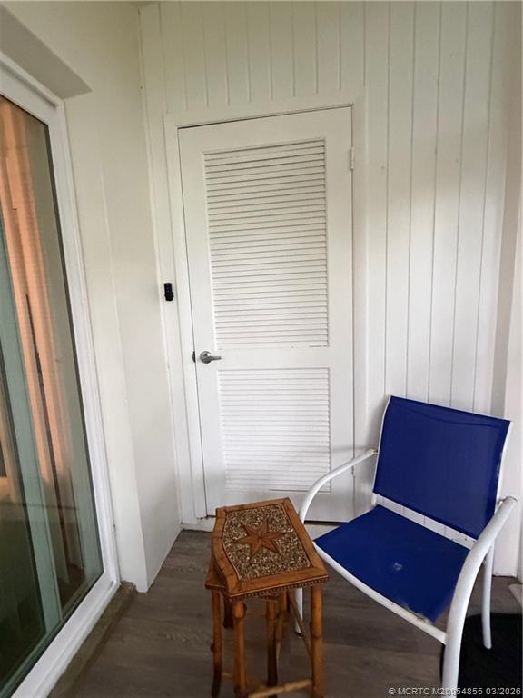 1225 Northwest 21st Street, Unit 7705 Stuart, FL 34994 - Photo 20 of 28 a view of room with furniture and wooden floor