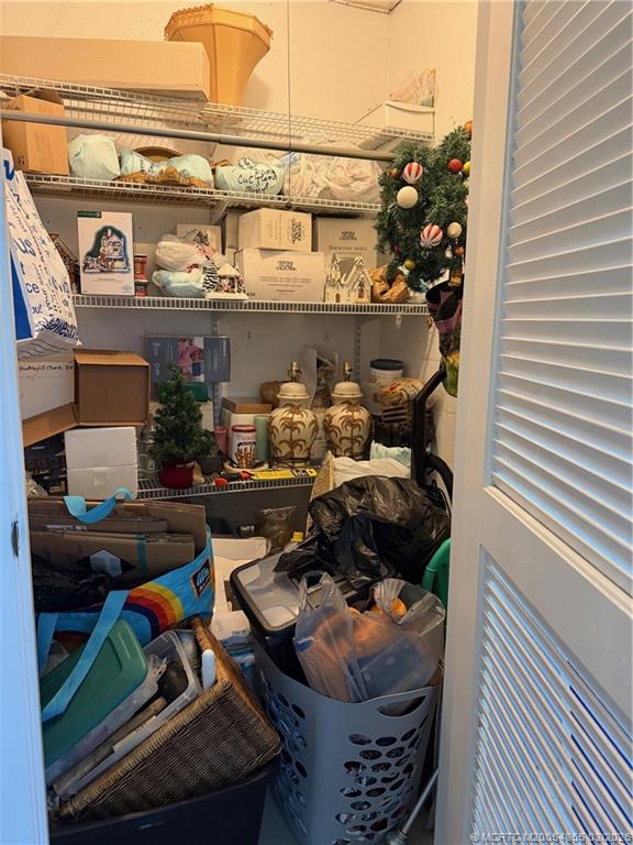 1225 Northwest 21st Street, Unit 7705 Stuart, FL 34994 - Photo 21 of 28 a room with lots of different colored cloths