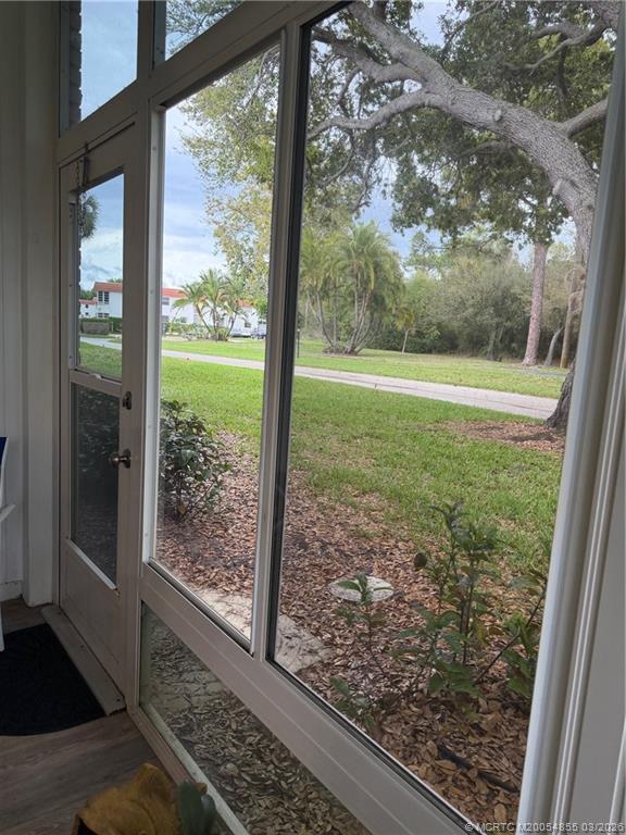 1225 Northwest 21st Street, Unit 7705 Stuart, FL 34994 - Photo 22 of 28 a view of a room with yard from a window