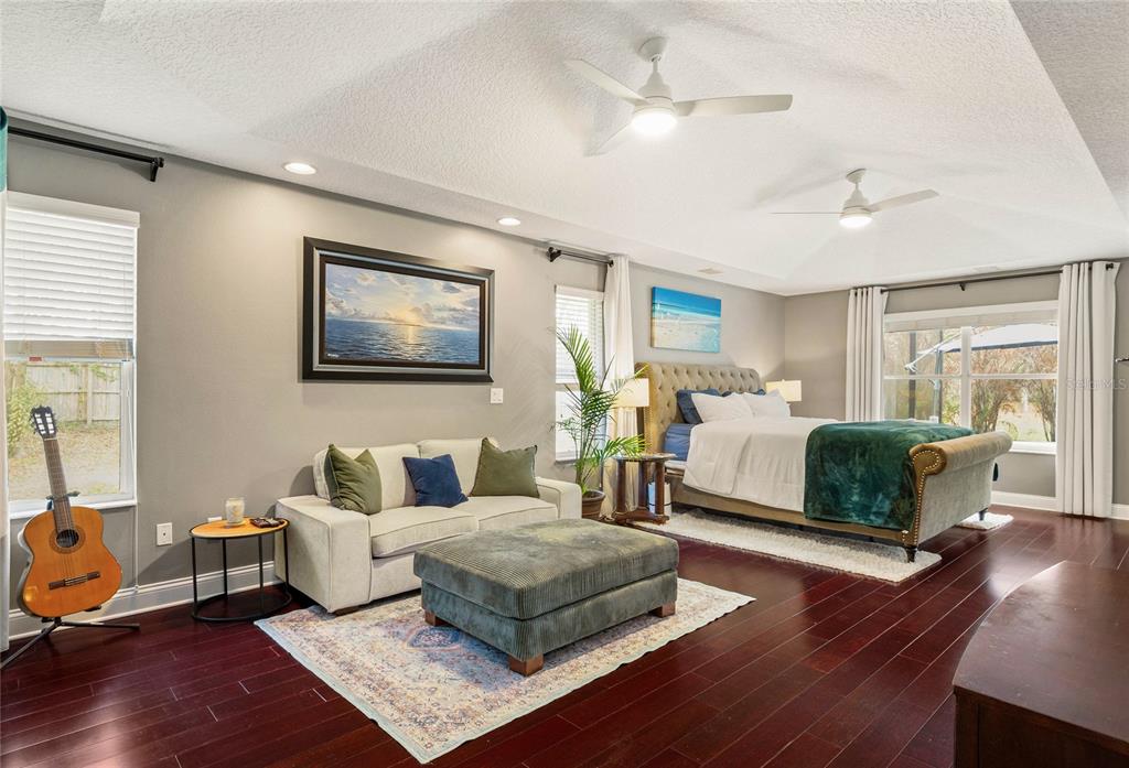 133 Ross Lake Lane Sanford, FL 32771 - Photo 13 of 32 a bedroom with a bed and wooden floor