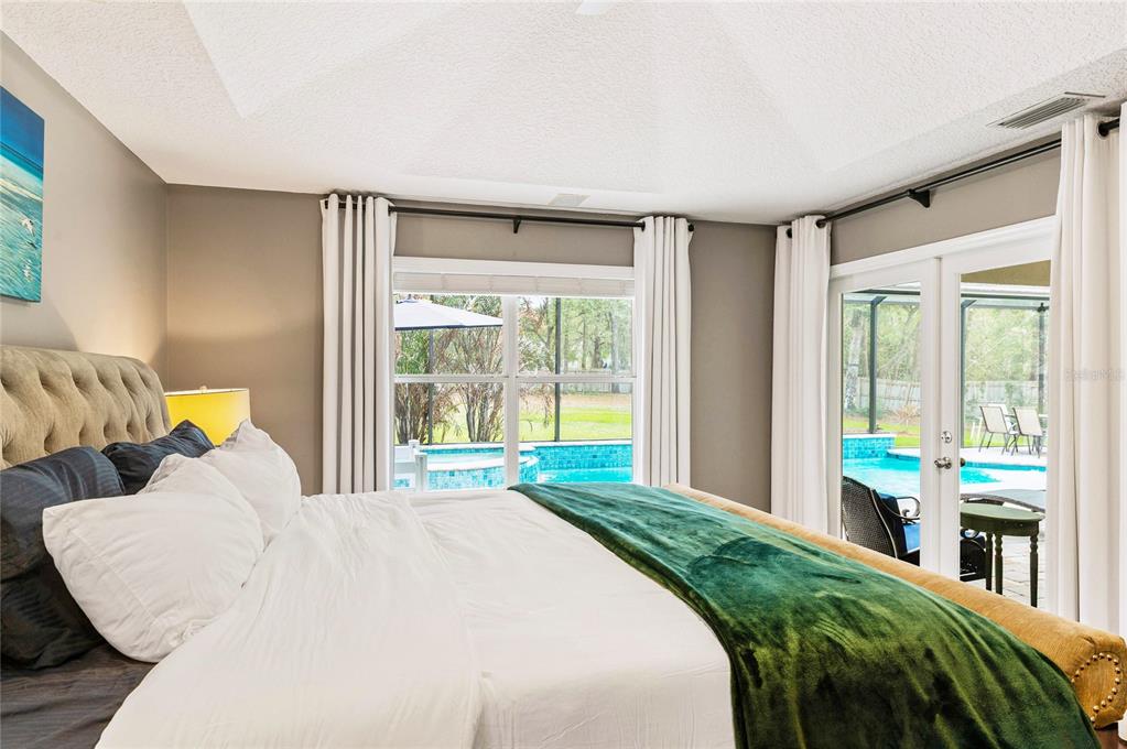 133 Ross Lake Lane Sanford, FL 32771 - Photo 14 of 32 a bed sitting in a bedroom next to a window