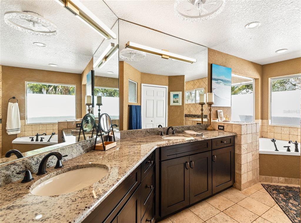 133 Ross Lake Lane Sanford, FL 32771 - Photo 17 of 32 a bathroom with a granite countertop sink mirror and double