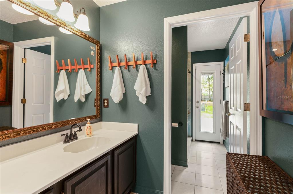 133 Ross Lake Lane Sanford, FL 32771 - Photo 24 of 32 a bathroom with a sink and a mirror