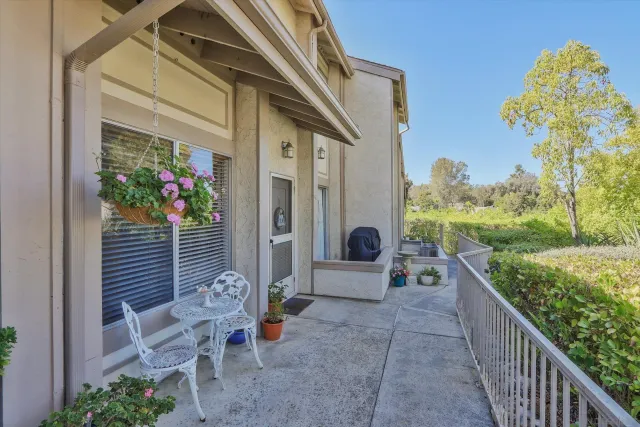 a backyard of a house with outdoor seating