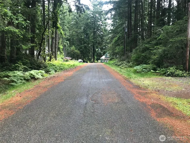 a view of a lake with outdoor seating