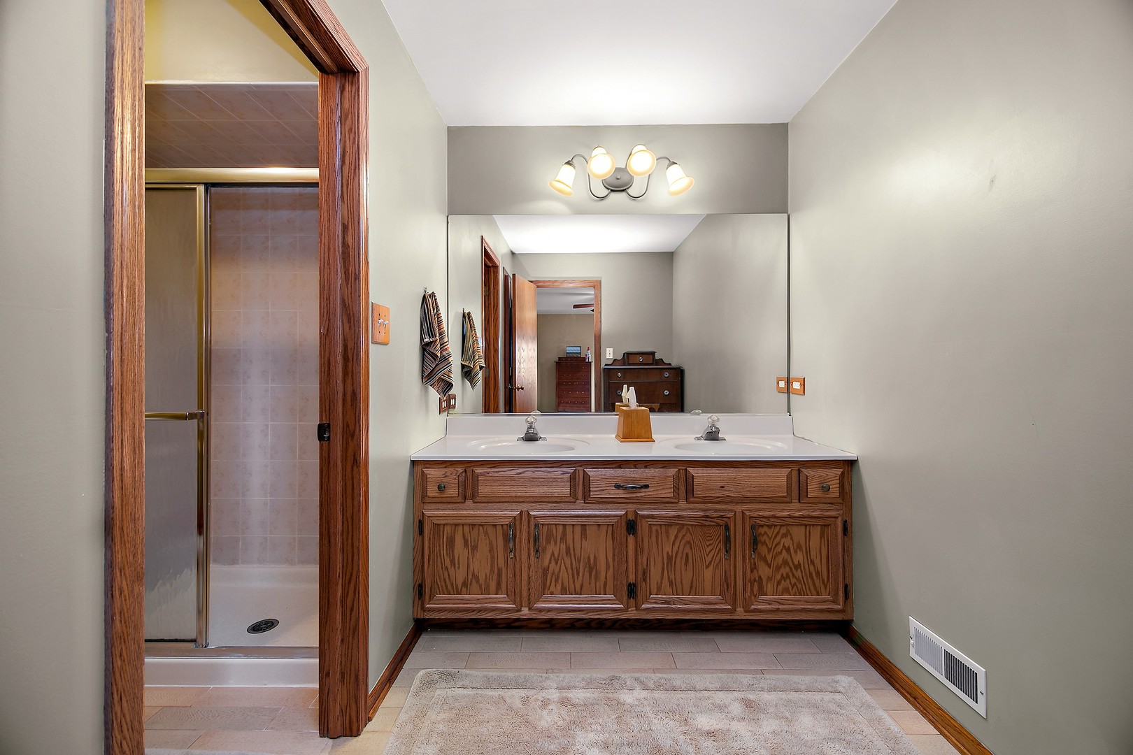 16200 Kingsport Road Orland Park, IL 60467 - Photo 16 of 32 a bathroom with a double vanity sink and a mirror