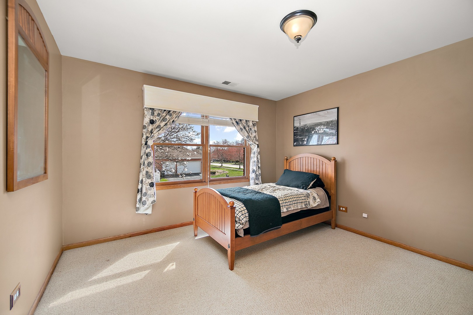 16200 Kingsport Road Orland Park, IL 60467 - Photo 18 of 32 a bed sitting in a bedroom next to a window