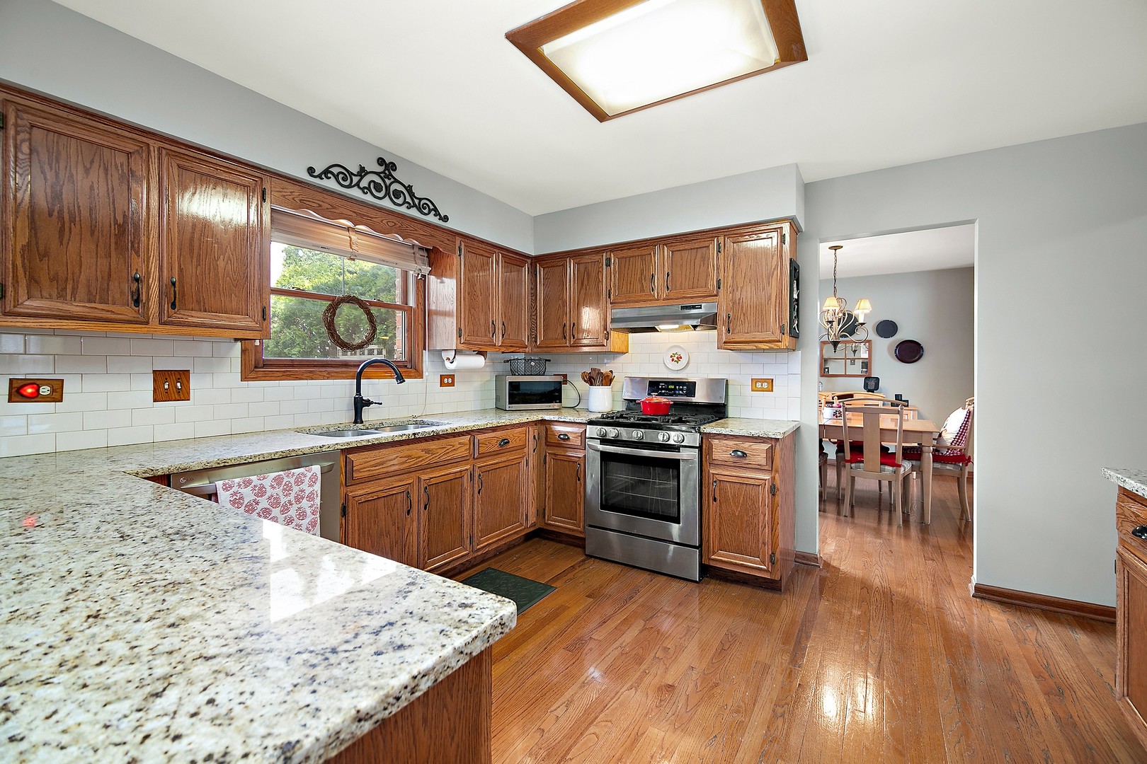 16200 Kingsport Road Orland Park, IL 60467 - Photo 5 of 32 a kitchen with a stove a sink and a refrigerator