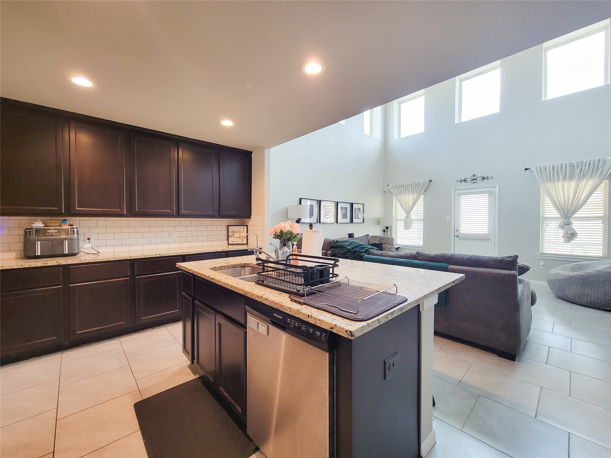 8003 Ecru Lane Rosharon, TX 77583 - Photo 17 of 43 a kitchen with stainless steel appliances granite countertop a sink stove and cabinets