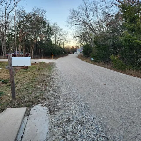 a view of outdoor space with trees all around