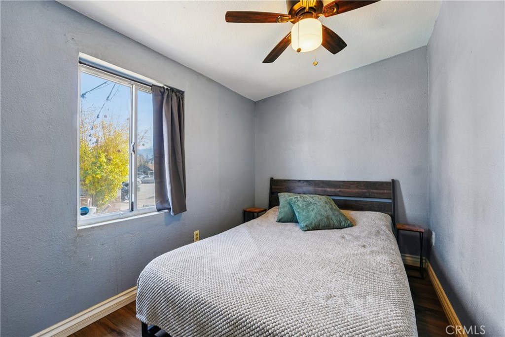 313 North 3rd Street Banning, CA 92220 - Photo 12 of 30 a bedroom with a bed and window