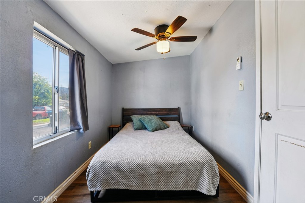 313 North 3rd Street Banning, CA 92220 - Photo 13 of 30 a bedroom with a bed and a window